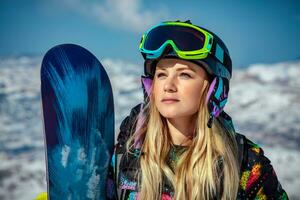 Beautiful woman with snowboard photo