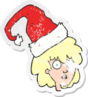 retro distressed sticker of a cartoon woman with santa hat png