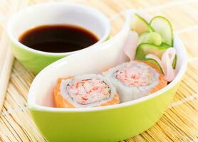 Tasty sushi with soy sauce photo