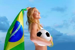 Happy fan of Brazilian football team photo