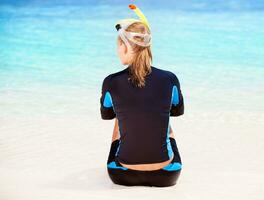 Calm diver girl on seashore photo