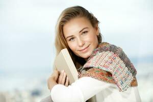 Pretty woman reads a book photo