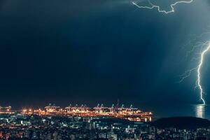 Lightning over night city photo