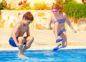 Happy children in the pool photo