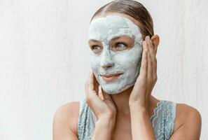 Beautiful Woman Using Facial Mask photo