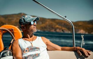 Man Relaxing on Sailboat photo