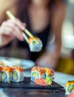 Eating sushi in restaurant photo