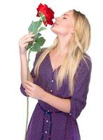 Smelling beautiful red rose photo