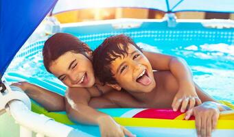 Happy children in the pool photo