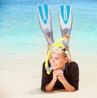 Happy diver on the beach photo
