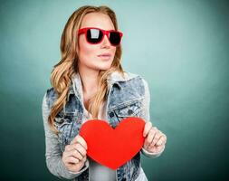 Cute girl with red heart photo