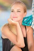 Beautiful woman on the sailboat photo