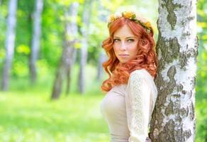 Fashionable girl in the park photo