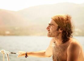 Handsome man on the yacht photo