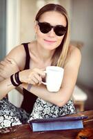 Stylish woman at outdoor cafe photo