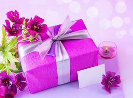 Gift box with pink flowers photo