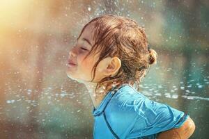 Baby Takes Shower Outdoors photo