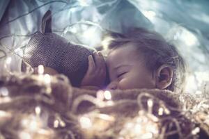 Sweet baby sleeping with soft toy photo