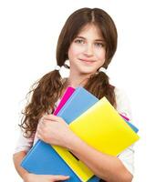 Cute schoolgirl with colorful books photo