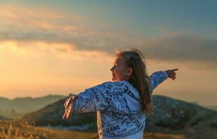 Happy girl in the mountains photo