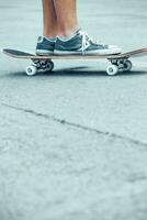 Teen boy on the skateboard photo