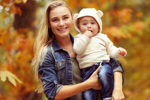 Happy family in autumn park photo