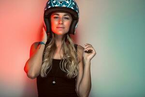Stylish fashionable biker girl in helmet photo