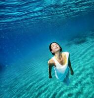 Beautiful female underwater photo