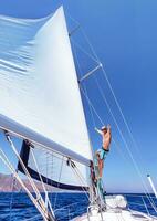 Cheerful man on sailboat photo