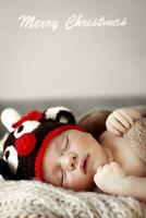 Cute baby sleeping in Christmas costume photo