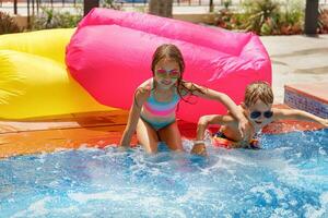 Two happy kids in the pool photo