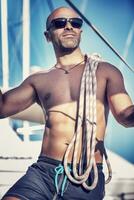 Handsome man on sailboat photo