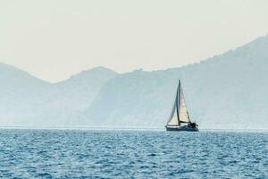 Beautiful seascape with white sailboat photo