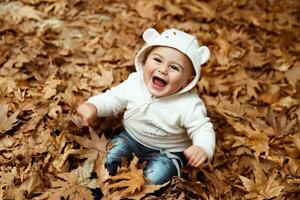 Happy boy in autumn forest photo