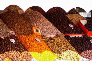 Dried fruits and legumes at a market stall in Morocco photo
