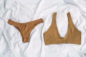 Basic bra and undies laying on bed. photo