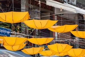 Street decorated with yellow umbrellas photo