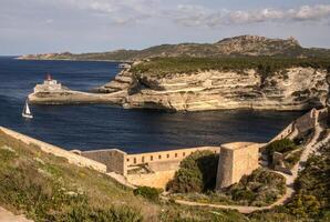 Beautiful old village of Bonifacio Corsica island, France suspended over amazing cliffs photo