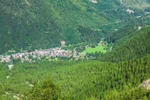 Hiking to Argentiere glacier with the view on the massif des Aiguilles Rouges in French Alps photo