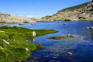 lake at gredos mountains in avila spain photo