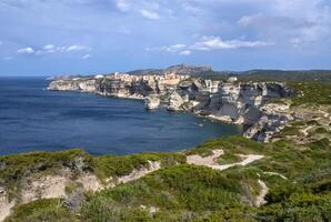 Beautiful old village of Bonifacio Corsica island, France suspended over amazing cliffs photo