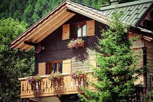 Traditional country house in switzerlands alps photo