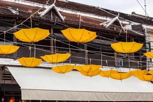 Street decorated with yellow umbrellas photo