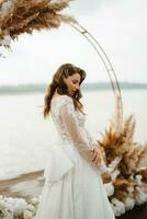 bride against the background of a yellow sunset photo