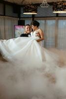 the first dance of the bride and groom inside a restaurant photo