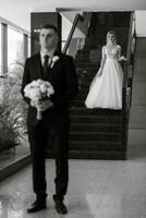 meeting of the bride and groom in the hotel lobby photo