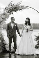 wedding ceremony of the newlyweds on the pier photo