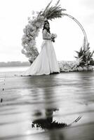 bride against the background of a yellow sunset photo