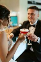 bride and groom inside a cocktail bar photo