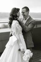 bride and groom first meeting on the roof of skyscraper photo